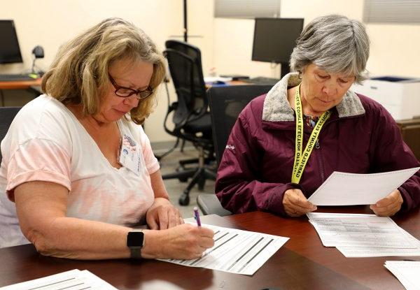 Two volunteers take part in Logic and Accuracy Testing for the for June 25 Primary Mail Ballot Election.