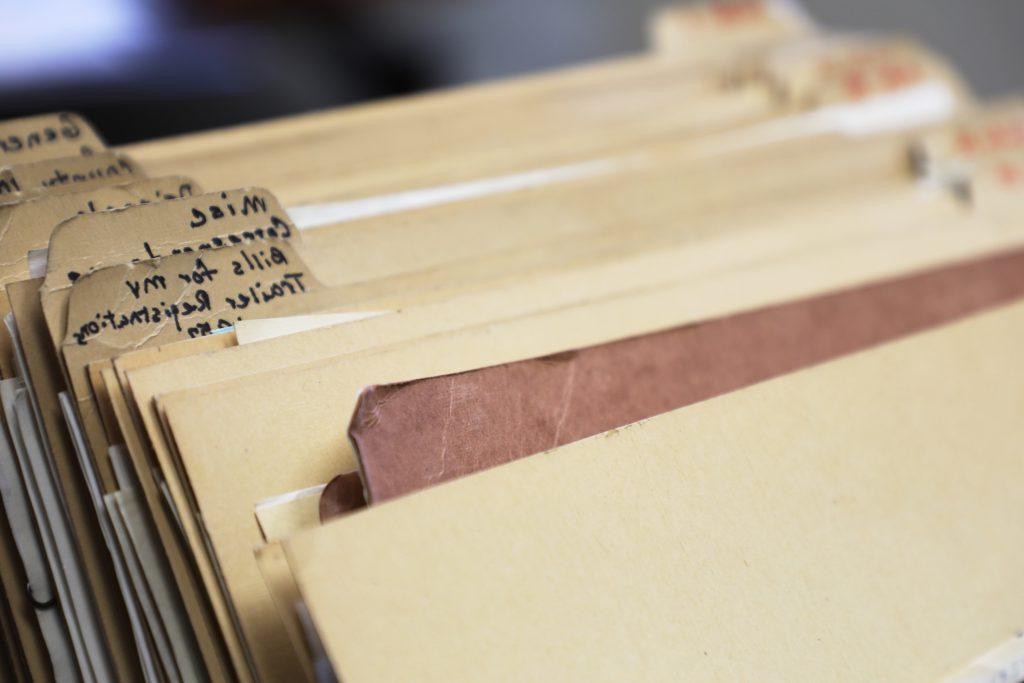 A stack of folders filled with correspondence letters from 1923 to 1976 at the 365买球app下载 书记及记录员's Office 在格伦伍德泉, CO.